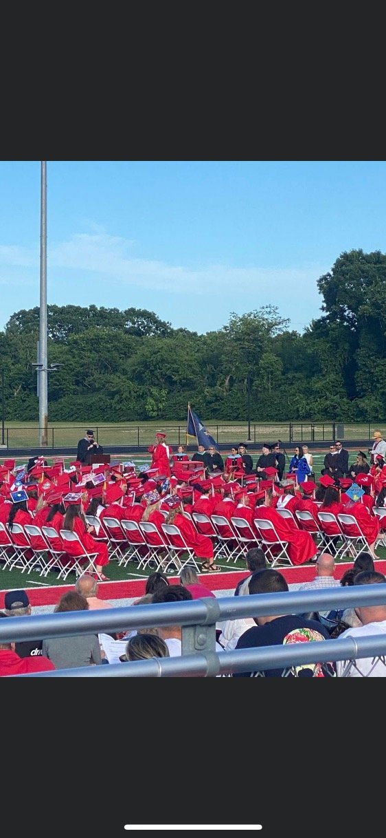 The East Islip High School graduating Class of 2022 makes their way to the graduation ceremony.